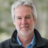 Headshot of seminar speaker, Dr. Iain Drummond, with a blurred background