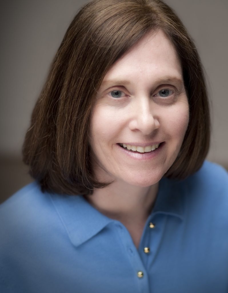 Headshot of Ellen A. Cowan, PhD, wearing a light blue collared shirt