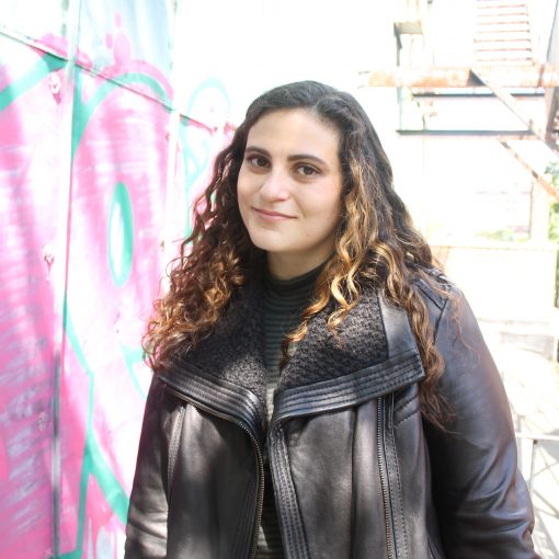 ITEHP student, Liz Boxer, smiling and wearing a black leather jacket