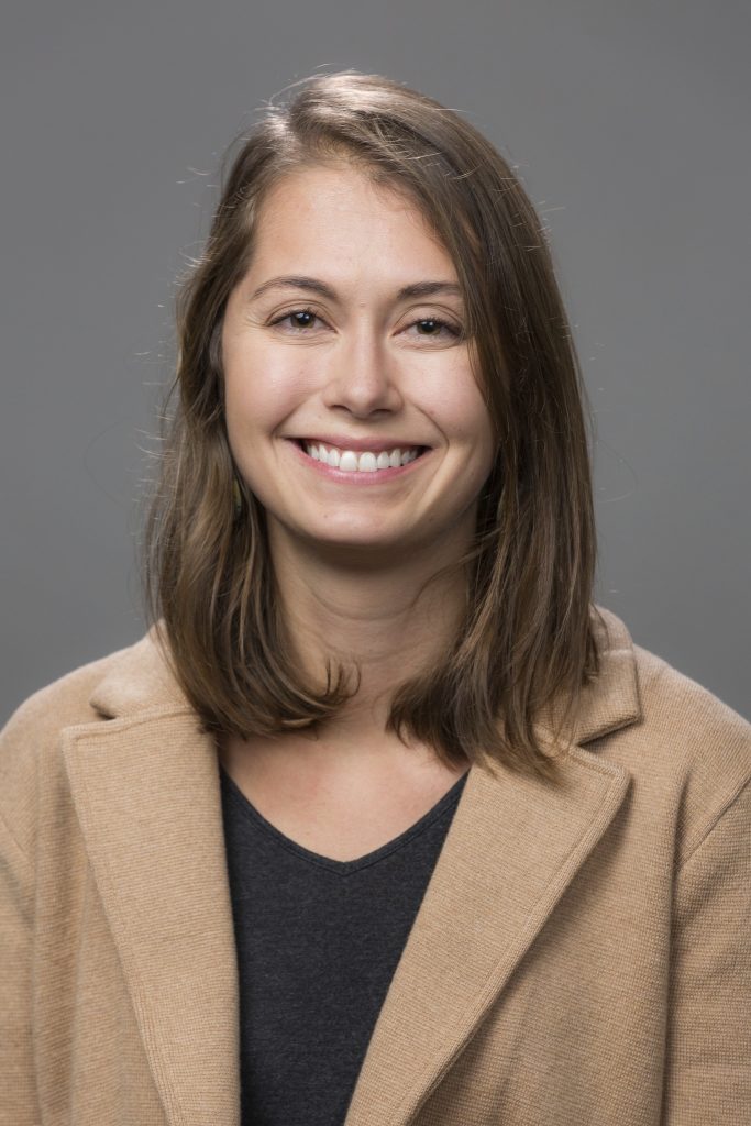 Zoie Diana, ITEHP PhD candidate, wearing a tan blazer over a black top