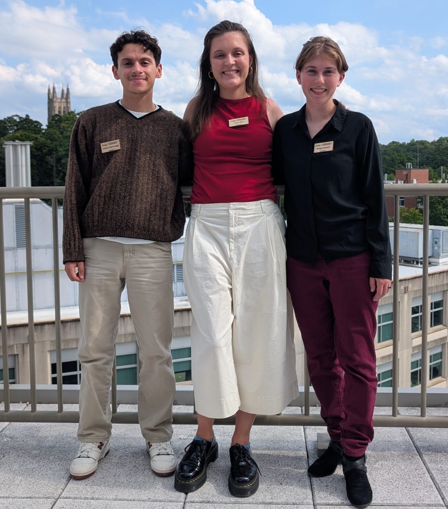First Year ITEHP students, Johann Valera-Vega, Olivia Kline, Bridget Reheard, on the Grainger Hall rooftop with the Duke Chapel in the background