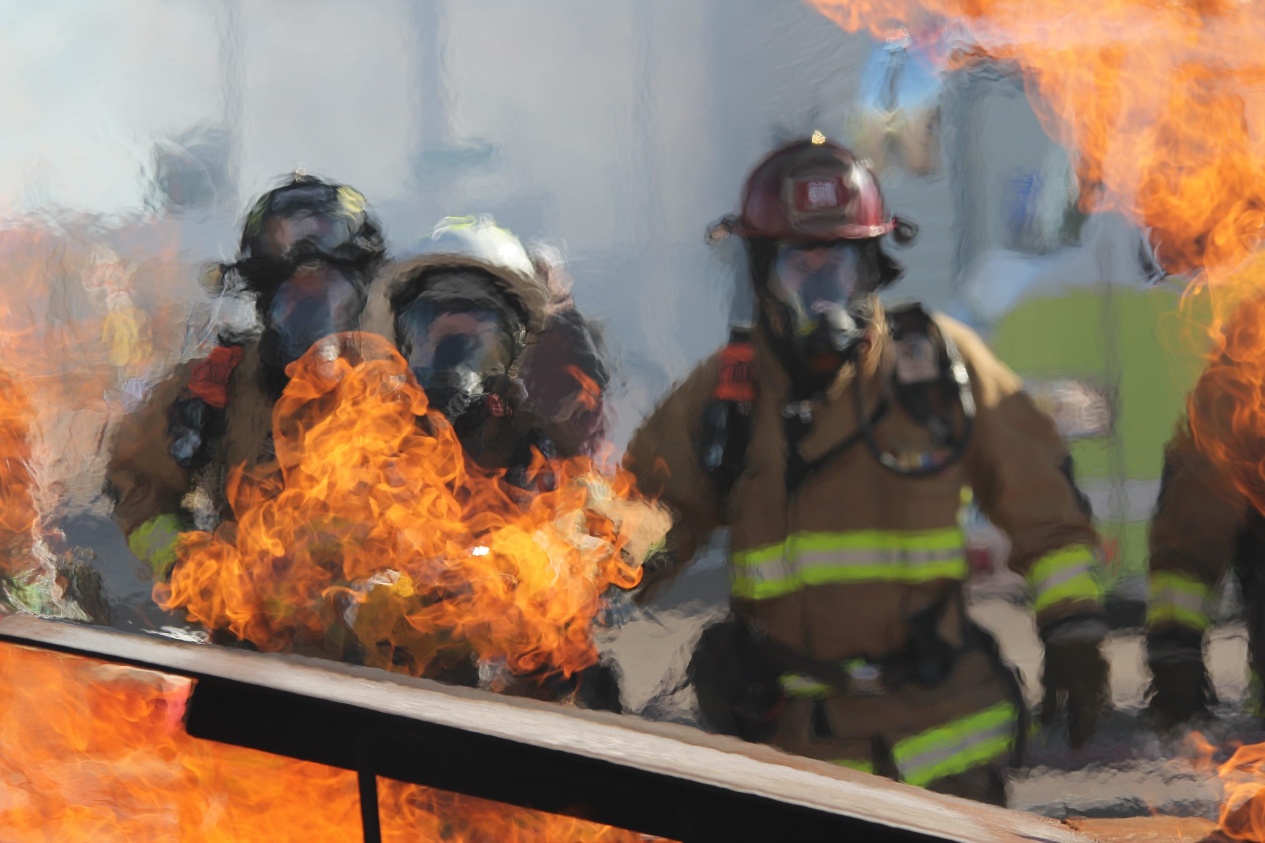 Photograph of firefighters near fire